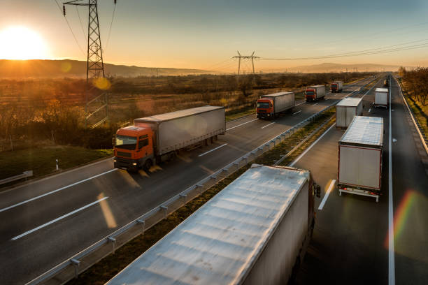 istock Delivery lorry trucks passing each other on a highway 1195086332
