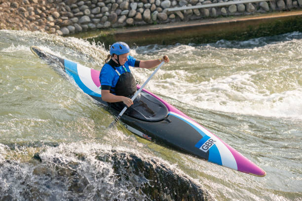 istock Great Britain Canoe Slalom athlete training on large drop on white water course 1195087063
