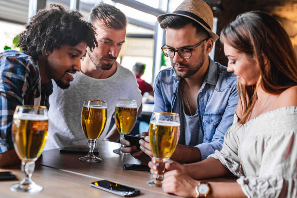 istock Group of friends drinking in a bar 1195087080