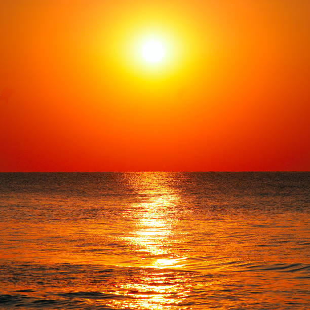 Bright sunrise over the sea. The concept is travel.
