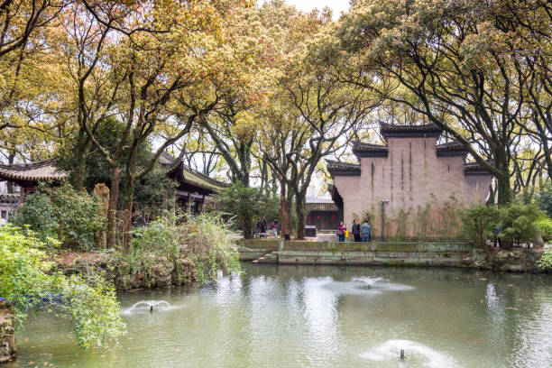 ponds and trees in the tianyige library which is also called building of treasured books, was built in ming dynasty, the earliest private library still in existence in china. - roof tile architectural detail architecture and buildings built structure imagens e fotografias de stock