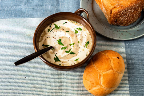 istock Creamy vegetable soup, bun and bread. 1195088144