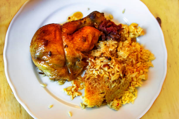 istock Baked chicken leg with apples and turmeric rice. 1195088244