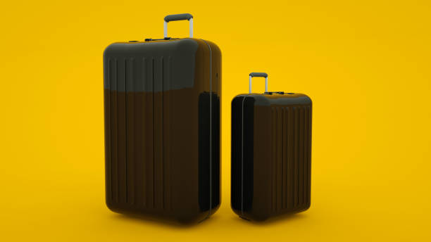 istock Two black travel suitcases isolated on yellow background, 3d rendering 1195092054
