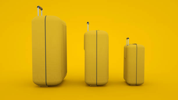 istock Travel concept. Three various sizes suitcases isolated on yellow background. 3d illustration 1195092171