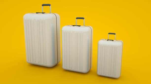 istock Travel concept. Three various sizes suitcases isolated on yellow background. 3d illustration 1195093420