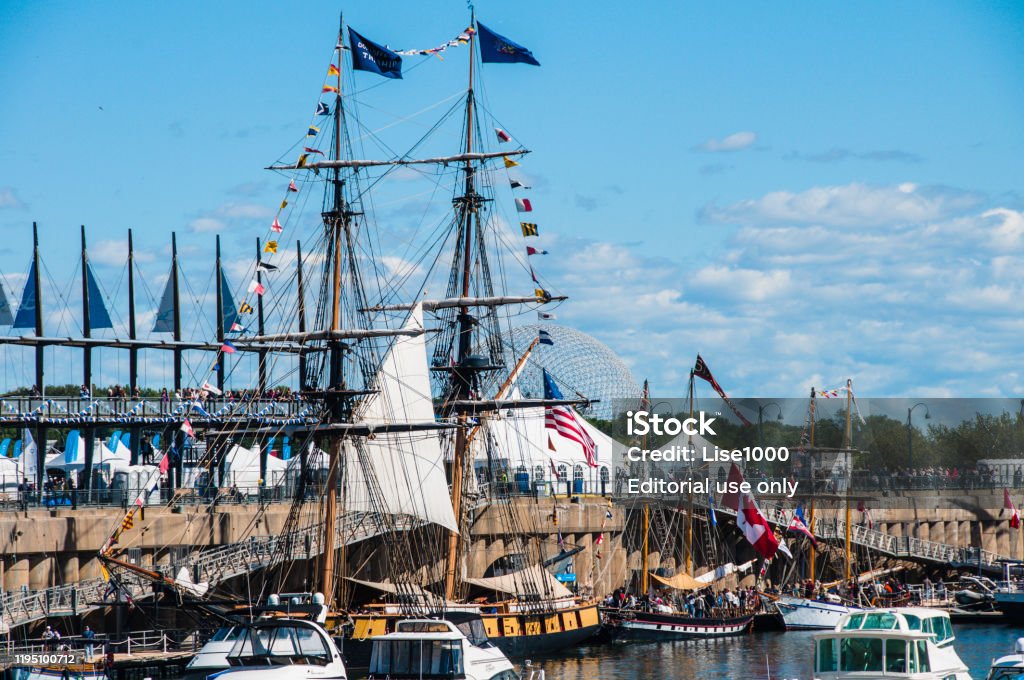 A marina with various boats. This port of Montreal is very busy during the summer. There are many countries that come to dock. It is a beautiful tourist spot. Montreal, Quebec, Canada, September 17, 2011. Blue Stock Photo