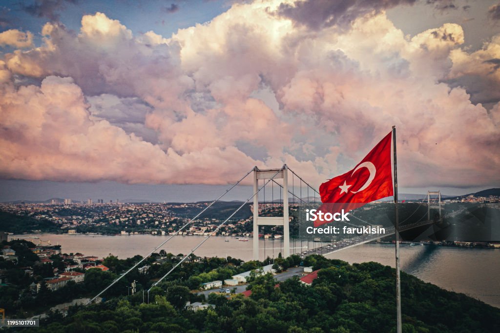 Dusk in bosporus Turkish flag bosporus Istanbul Stock Photo