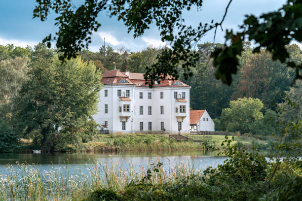 View of castle Grunewald across the lake Berlin, Germany - september 26, 2019: View of castle Grunewald across the lake on a bright autumn day grunewald berlin stock pictures, royalty-free photos & images