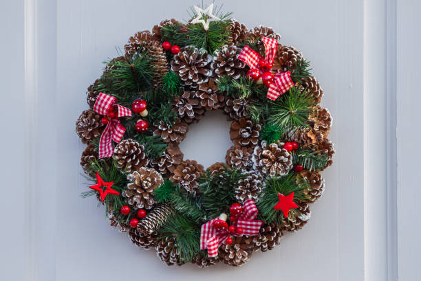 istock Christmas wreath on a white door 1195103886