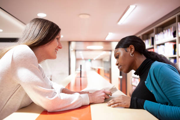 Administrator and Student meeting in the library