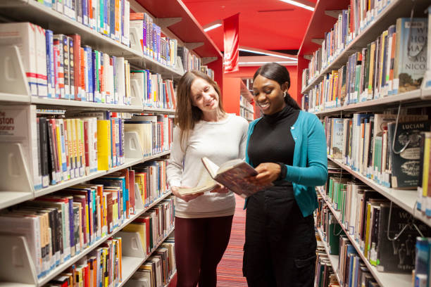 istock Administrator and Student meeting in the library 1195103947