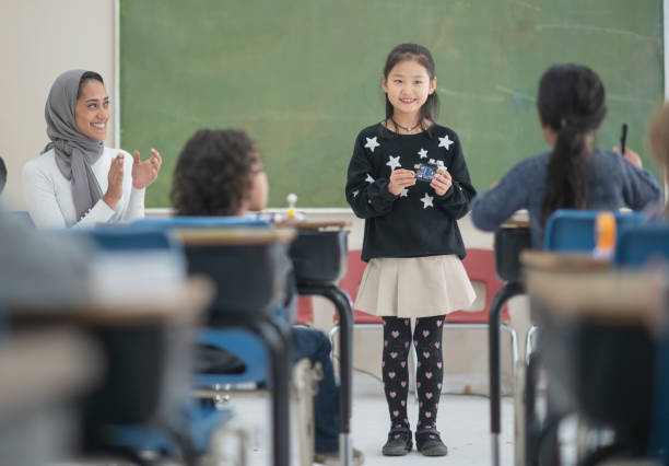 istock Asian Elementary Student Presenting in Class stock photo 1195105121