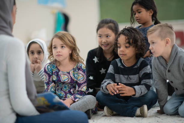 istock Story time with Multi-Ethnic Elementary Students stock photo 1195105124