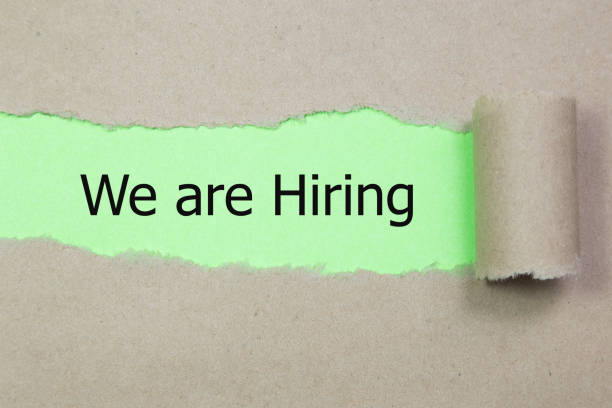 istock We're Hiring written under torn paper. Human resource concept, strategy, plan, planning. 1195108088