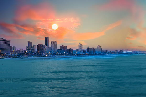 istock Durban city skyline from ocean with illuminated beach front buildings 1195110226