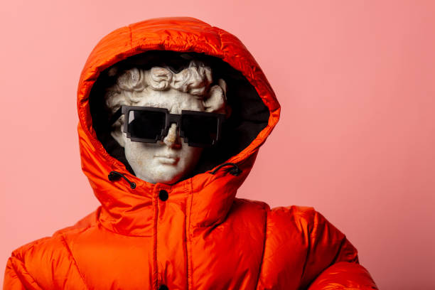 istock antique statue dressed in down jacket and sunglasses 1195114466