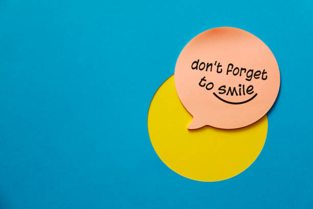 Don't forget to smile Don't forget to smile. Close-Up Of Text On Paper smiley face postit stock pictures, royalty-free photos & images