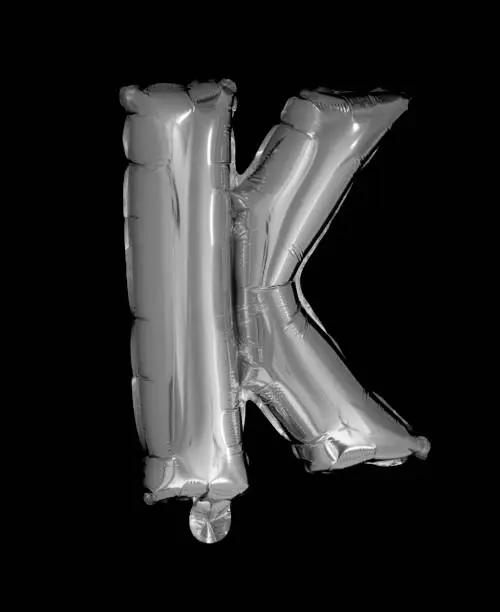 Silver Foil Balloons Alphabet on a black background