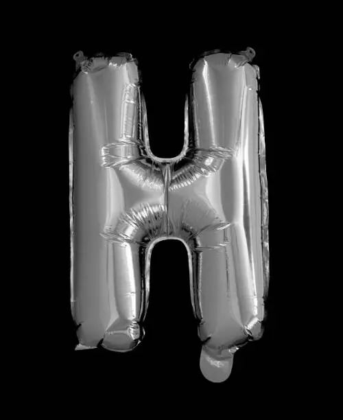 Silver Foil Balloons Alphabet on a black background