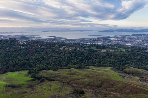 Winter rains cause lush green grass and foliage to grow in the peaceful hills of the East Bay, just east of Oakland, Berkeley, and El Cerrito in the San Francisco Bay Area.
