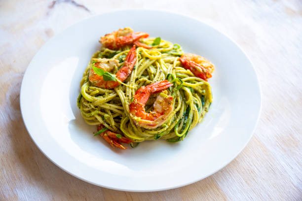 istock Spaghetti with prawns and pesto sauce 1195121650