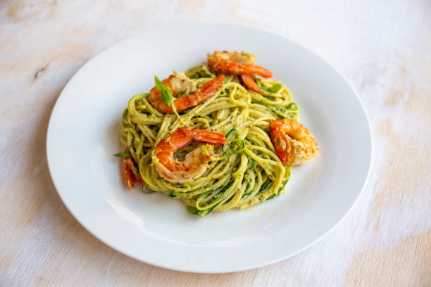 istock Spaghetti with prawns and pesto sauce 1195121654
