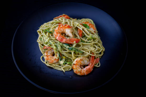 istock Spaghetti with prawns and pesto sauce 1195121979