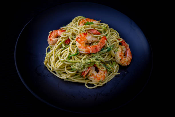 istock Spaghetti with prawns and pesto sauce 1195121980