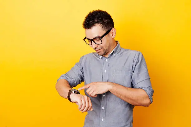 Vector illustration of Young man touching smartwatch