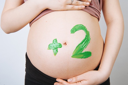 Pregnant woman +2 twins concept, mother to be