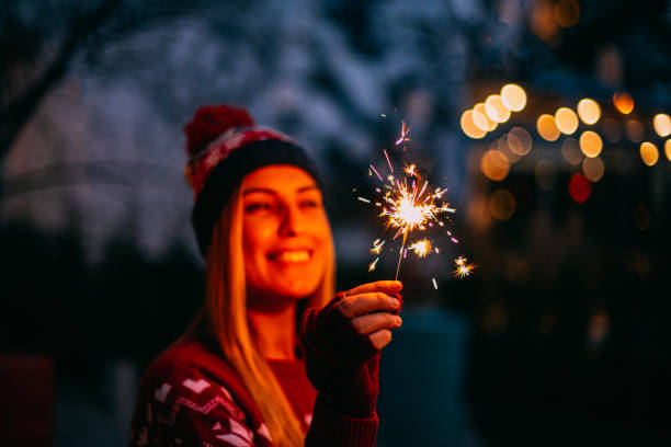 istock Young Woman Holding Sparkler 1195124424