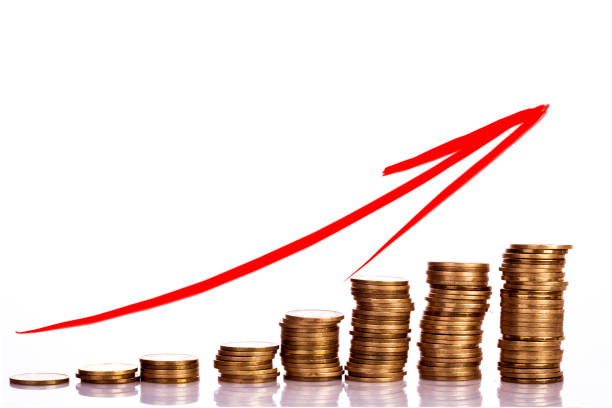 istock Stack Of Coins And A Red Arrow Forming A Financial Graph- Prosperity Concept 1195124651