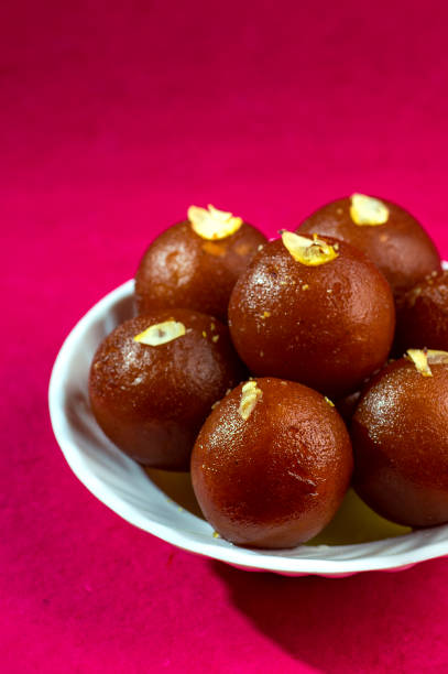 istock Indian Dessert : Gulab Jamun in white bowl 1195125399