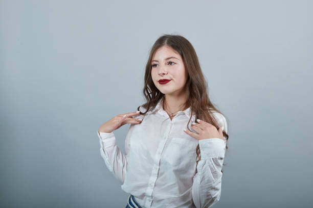 istock Cheerful caucasian woman holding hands on shoulder, looking aside, smiling 1195127130