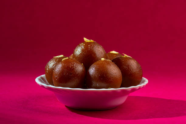 istock Indian Dessert : Gulab Jamun in white bowl 1195127847