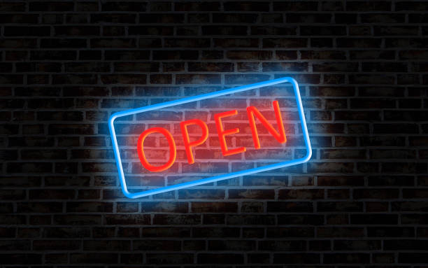 istock Open sign neon lamp. sparkles at night on brick wall 1195129294