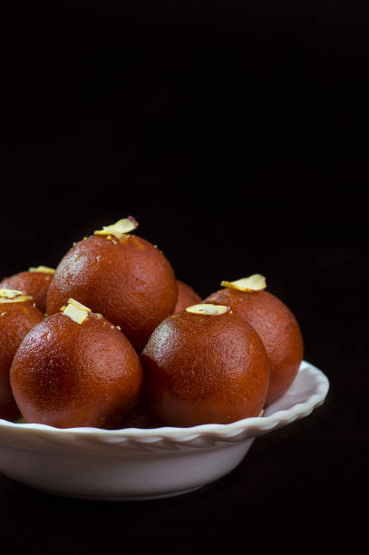 istock Gulab Jamun, Indian dessert topped with pistachio 1195129957