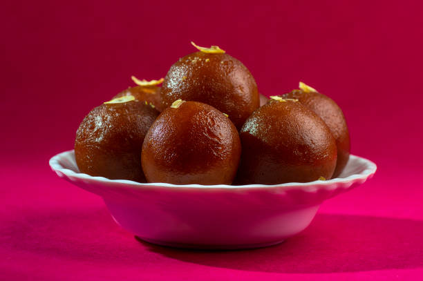 istock Indian Dessert : Gulab Jamun in white bowl 1195130030