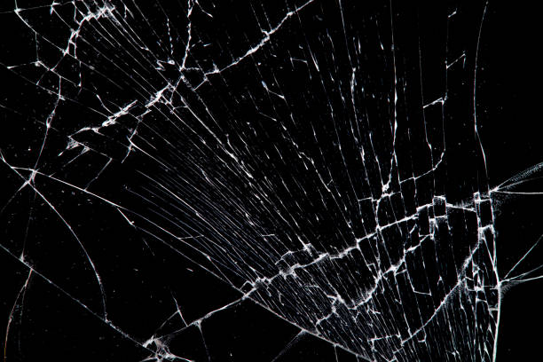 istock cracked glass isolated on a black background. 1195133711