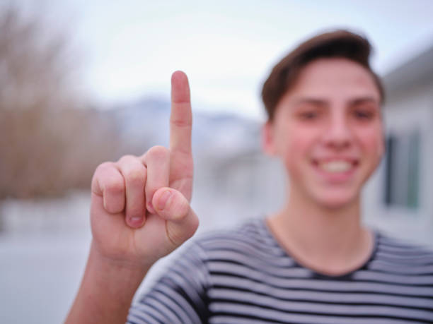 istock High School Student Showing Number One 1195136550