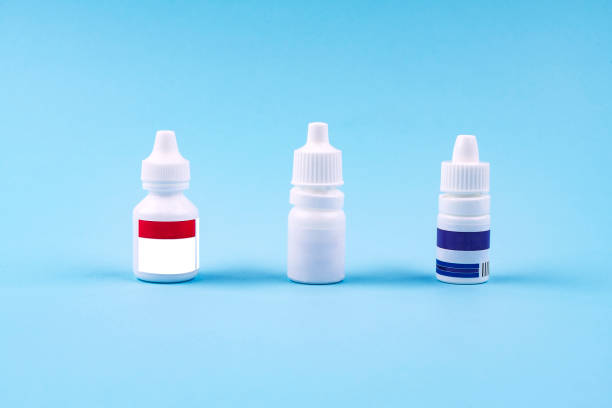 istock Medicine bottle isolated blue background 1195136738