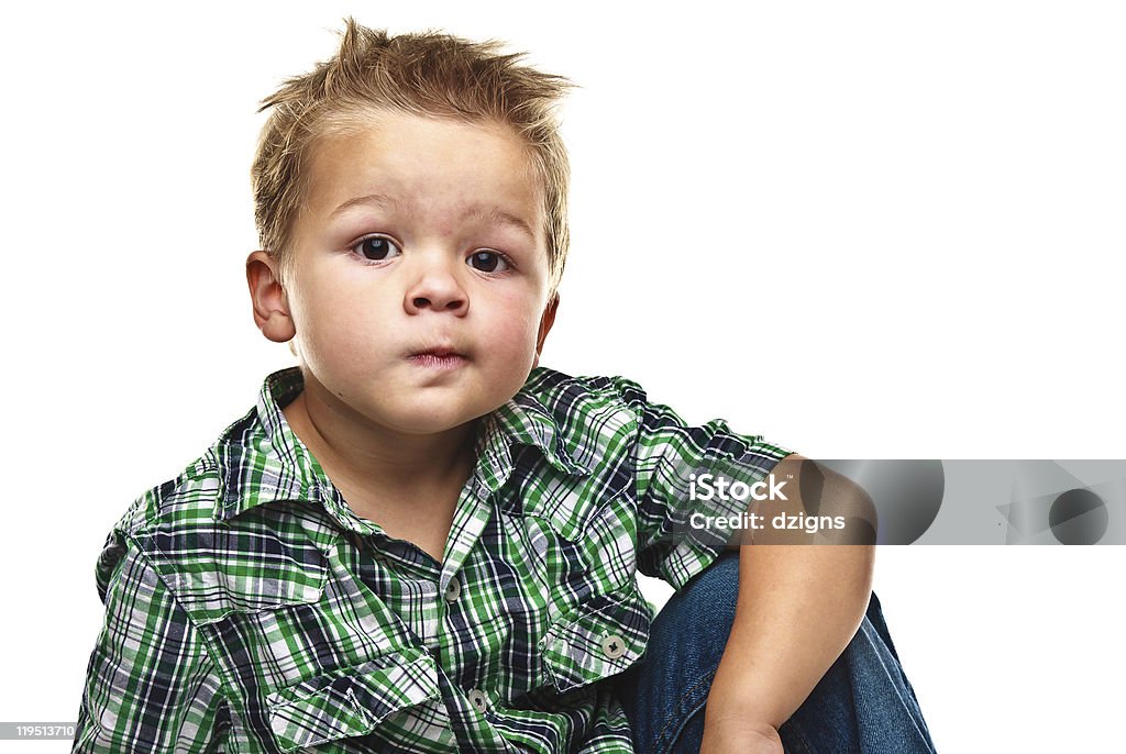 Adorable petit garçon regardant pensif. - Photo de Blanc libre de droits