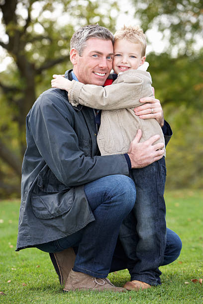 istock Father And Son Hugging On Outdoor Autumn Walk 119513907