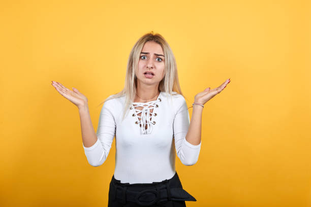istock Caucasian attractive girl making unimportant gesture while lifting the shoulders 1195142721