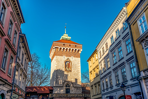 17/02/2019 Krakow, Poland, tourists walking along the main pedestrian Florianska street of city on a sunny day