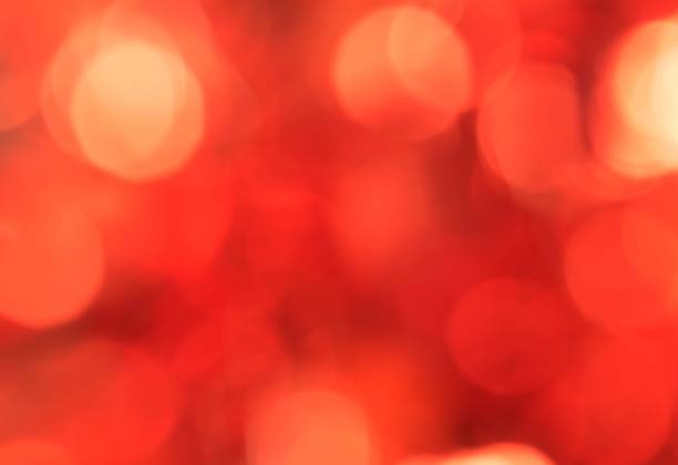 istock Red and orange colored bokeh light balls. 1195148048
