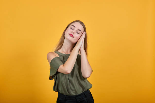 istock Gorgeous young caucasian girl making sleep gesture in dorable expression 1195149436