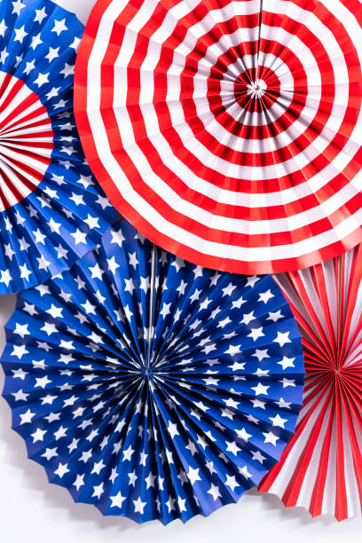 istock Red, white, and blue paper fans for July 4th celebration. 1195155382