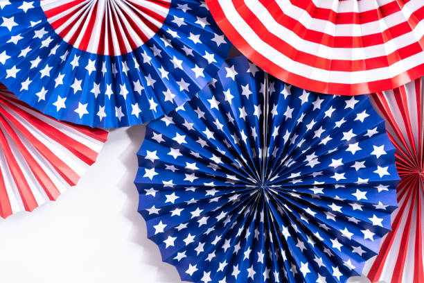 istock Red, white, and blue paper fans for July 4th celebration. 1195155462